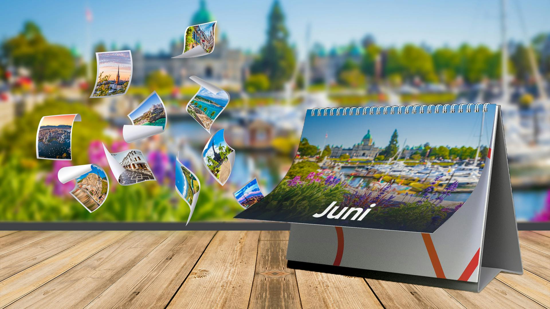 Kalender mit einem Bild vom See von Juni steht auf einem kleinen Tisch aus dem mehr Bilder rausfliegen