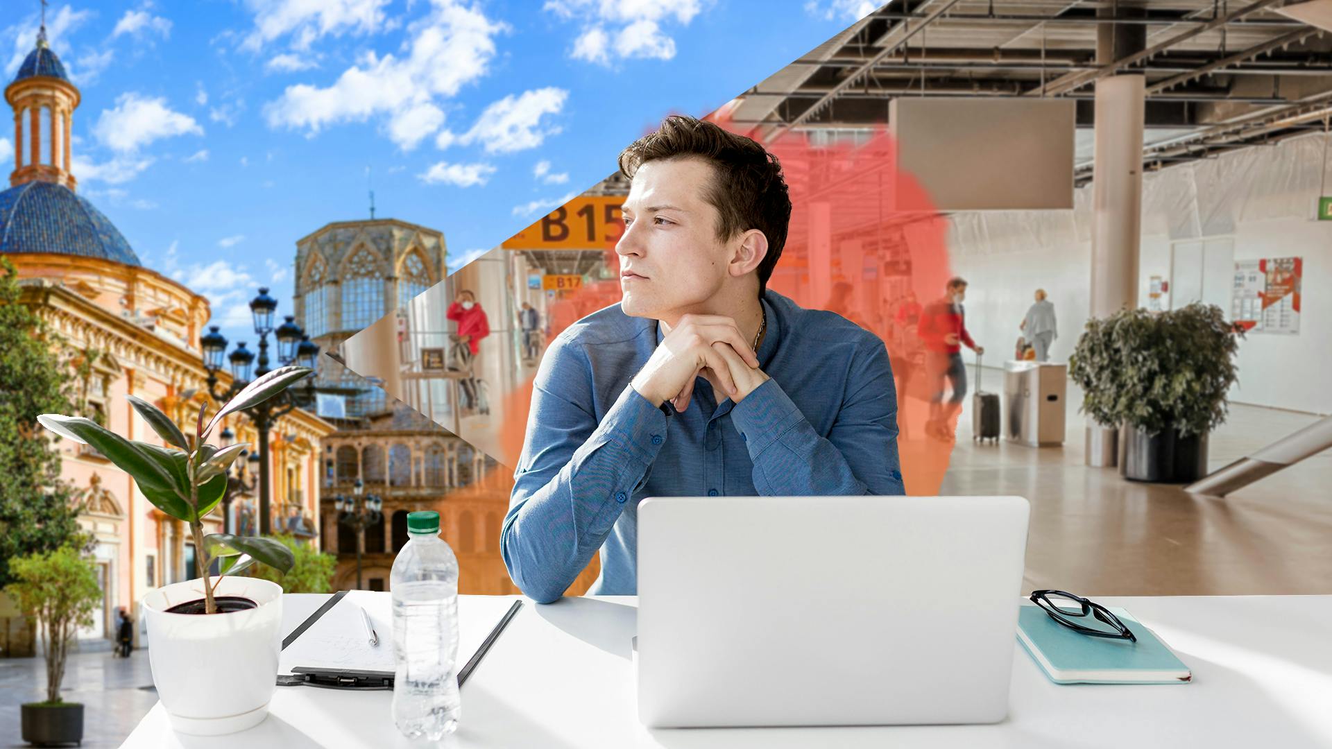 Mann arbeitet am Laptop und guck auf eine sonnige Stadt