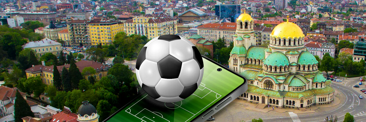 fußball und handy über einer stadt