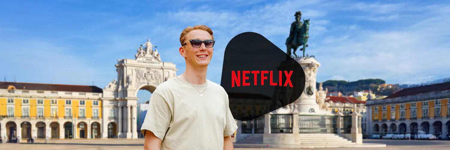 guy with sunglasses is standing next to the netflix logo in lisbon