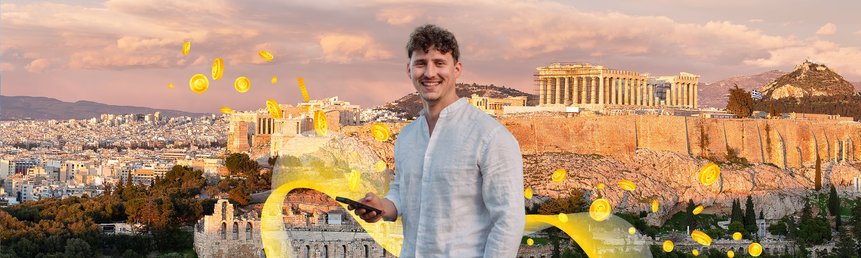 Mann mit Smartphone in der Hand neben Münzen vor der Acropolis