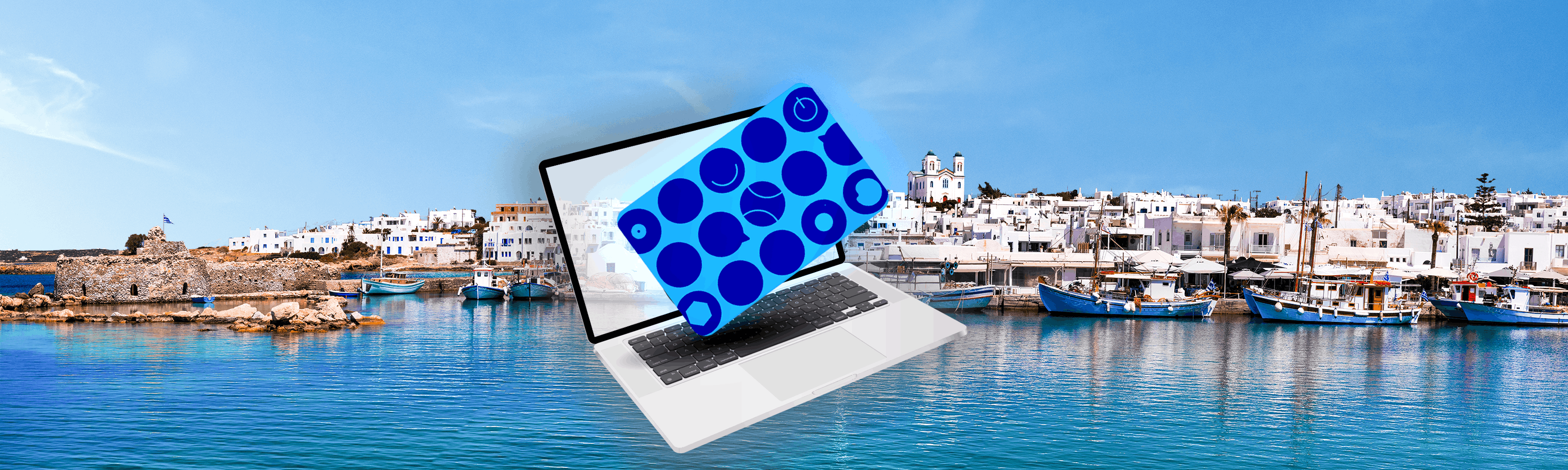 Laptop with a blue card in front and water with boats in the background