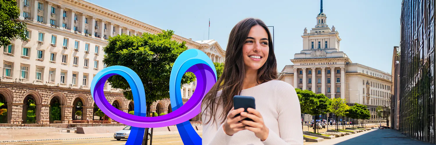 Smiling girl looking at her phone with purple and blue Proximus arches in the background