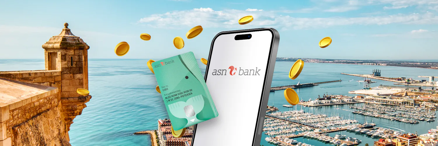 Groene betaalpas met wit telefoonscherm met op de achtergrond Alicante