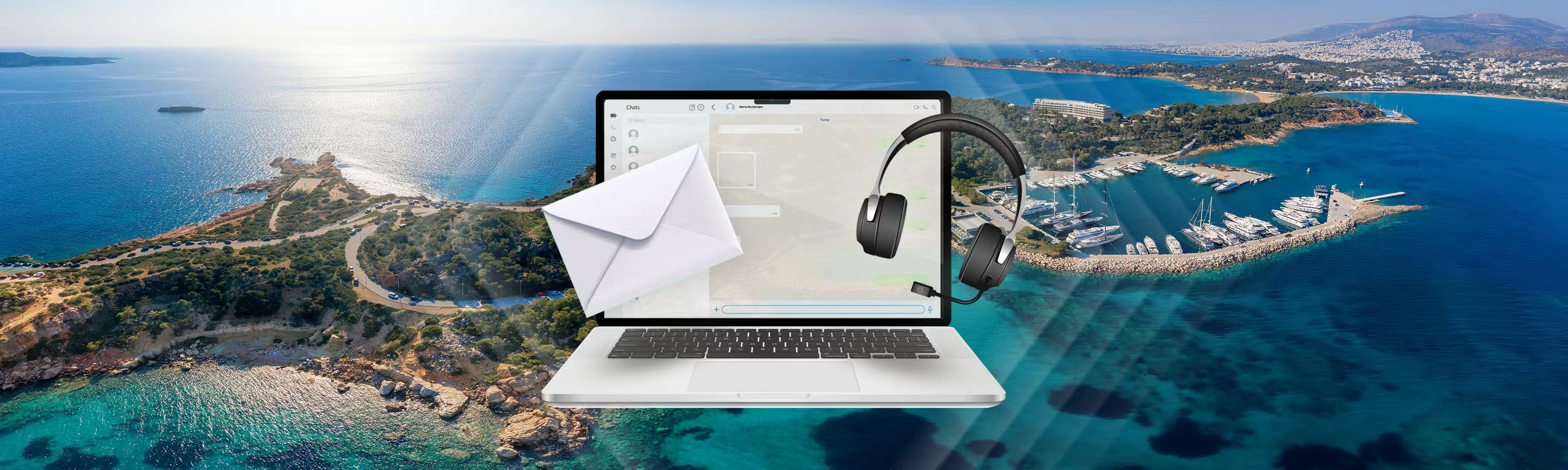 Laptop with open screen in front of a beautiful greek island